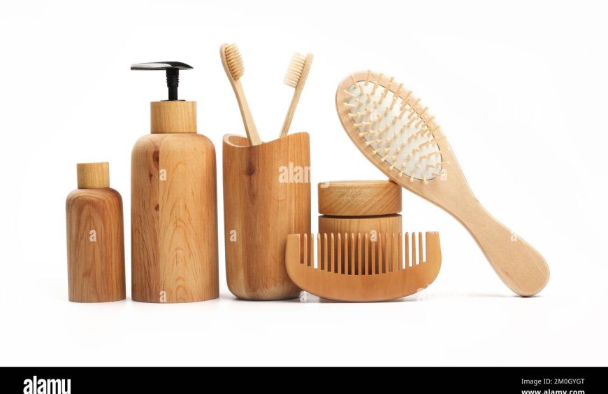 close-up-beauty-care-and-personal-hygiene-products-in-wooden-containers-toothbrushes-and-comb-isolated-on-white-background-low-angle-side-view-cl-2M0GYGT